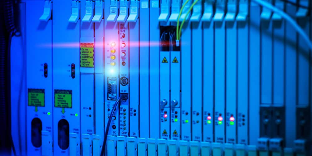 Data-center PoE infrastructure connecting cameras, environmental sensors, digital signage, and smart lighting.