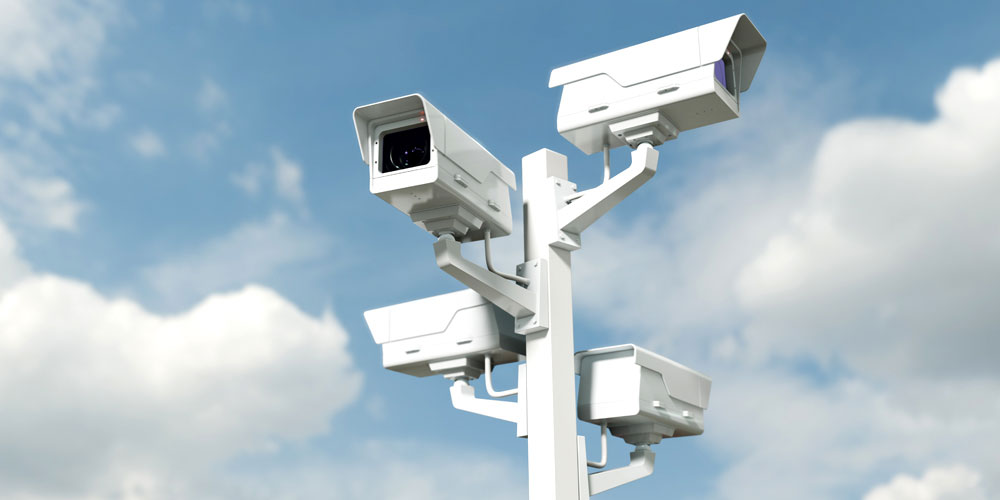 24-port PoE switch connecting IP cameras through 10G uplinks to a network backbone